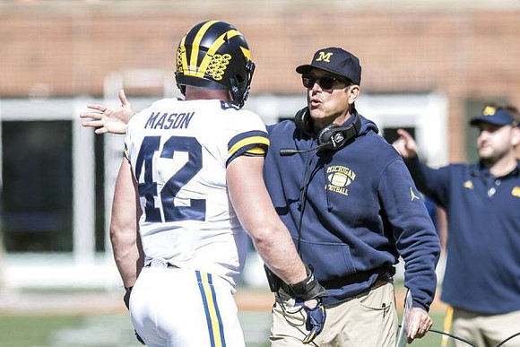 Ben Mason (42) and Jim Harbaugh