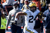 Zach Charbonnet (24) and Illinois Head Coach Lovie Smith