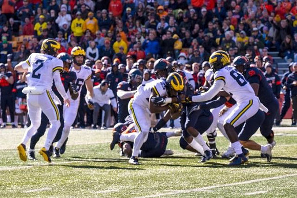 Shea Patterson (2), Luke Schoonmaker (86), Hassan Haskins (25), and Nick Eubanks (82)