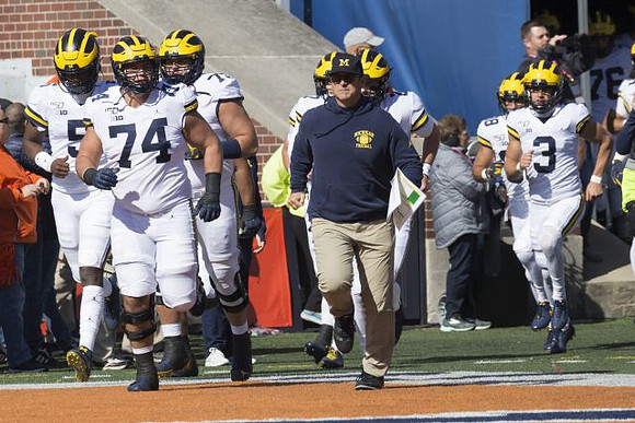 Joe Milton (5), Ben Bredeson (74), Jalen Mayfield (73), Jim Harbaugh, and Quinn Nordin (3)