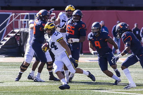 Zach Charbonnet (24) and Jon Runyan Jr. (75)