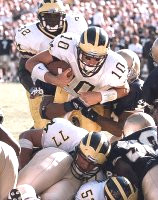 Tom Brady (10), Anthony Thomas (32), Jon Jansen (77), and Chris Ziemann(52)