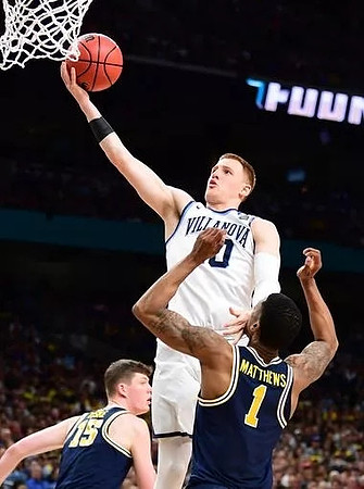 Jon Teske (15) and Charles Matthews (1)