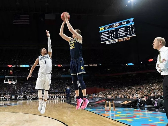 Duncan Robinson (22) and John Beilein