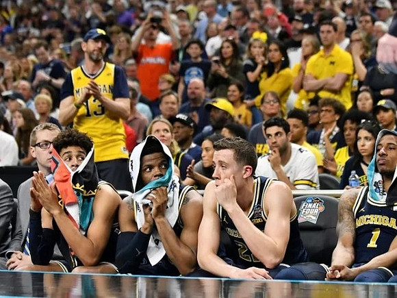 Jordan Poole (2), Zavier Simpson (3), Duncan Robinson (22), and Charles Matthews (1)