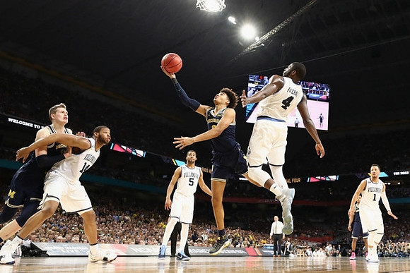 Moritz Wagner (13) and Jordan Poole (2)