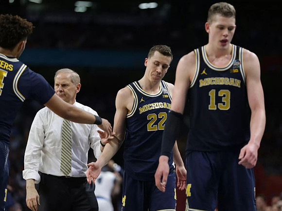 Isaiah Livers (4), John Beilein, Duncan Robinson (22), and Moritz Wagner (13)