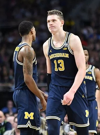 Charles Matthews (1), Moritz Wagner (13), and Zavier Simpson (3)