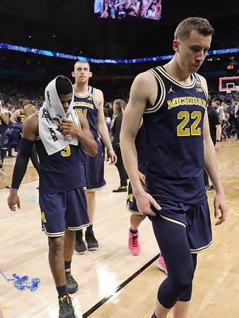 Zavier Simpson (3), Austin Davis (51), and Duncan Robinson (22)