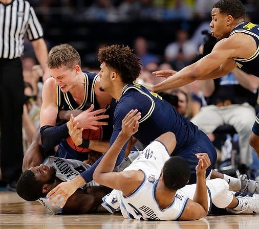 Moritz Wagner (13), Isaiah Livers (4), and Jaaron Simmons (5)