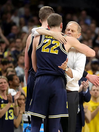 Moritz Wagner (13), Duncan Robinson (22), and John Beilein