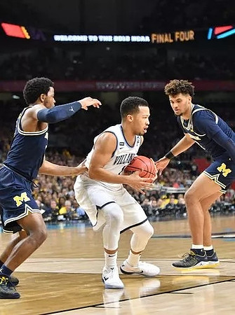 Zavier Simpson (3) and Isaiah Livers (4)