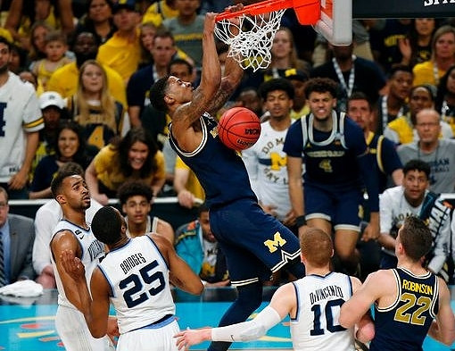 Charles Matthews (1), Isaiah Livers (4), and Duncan Robinson (22)