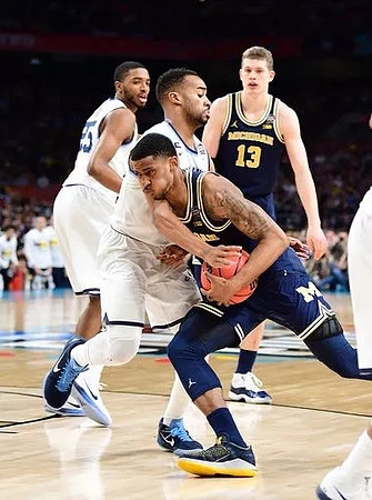 Charles Matthews (1) and Moritz Wagner (13)
