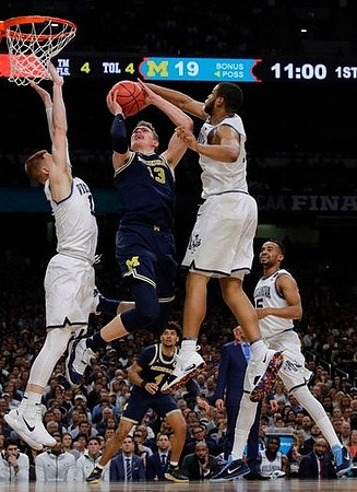 Moritz Wagner (13) and Isaiah Livers (4)