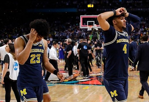 Ibi Watson (23) and Isaiah Livers (4)