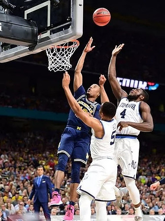 Muhammad-Ali Abdur-Rahkman (12) and Villanova Head Coach Jay Wright