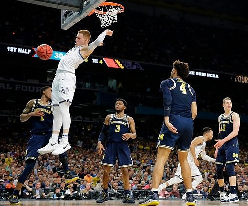 Charles Matthews (1), Zavier Simpson (3), Isaiah Livers (4), and Moritz Wagner (13)