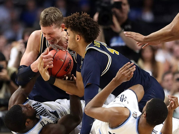 Moritz Wagner (13) and Isaiah Livers (4)