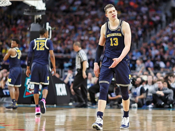 Zavier Simpson (3), Muhammad-Ali Abdur-Rahkman (12), and Moritz Wagner (13)