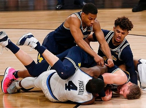 Jaaron Simmons (5), Moritz Wagner (13), and Isaiah Livers (4)