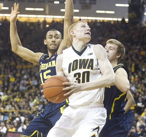 Jon Horford (15) and Spike Albrecht (2)