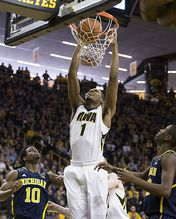 Derrick Walton Jr. (10) and Caris LeVert (23)