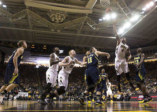 Spike Albrecht (2), Nik Stauskas (11), Glenn Robinson III (1), and Caris LeVert (23)
