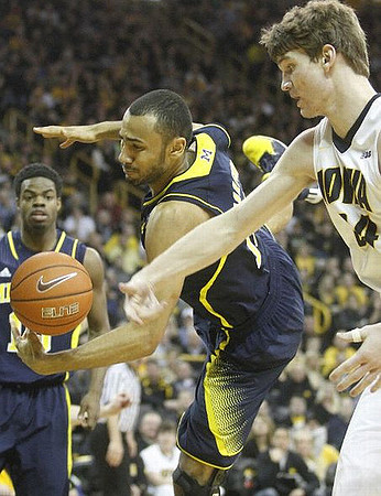 Derrick Walton Jr. (10) and Jon Horford (15)