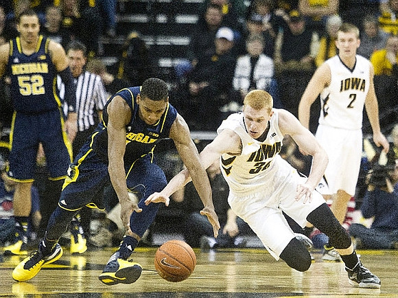 Jordan Morgan (52) and Glenn Robinson III (1)