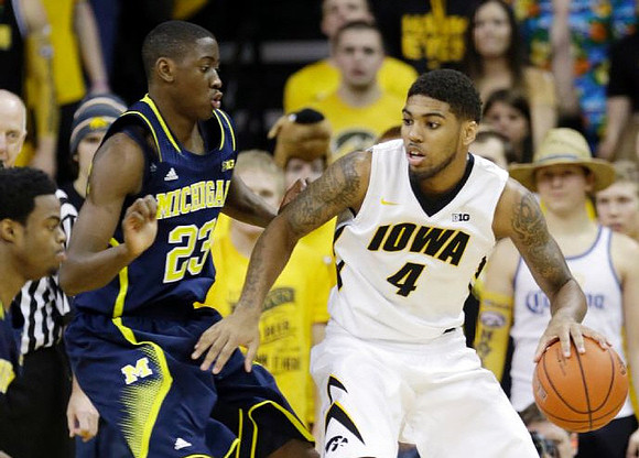 Derrick Walton Jr. (10) and Caris LeVert (23)