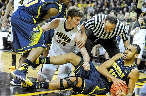 Derrick Walton Jr. (10) and Jon Horford (15)