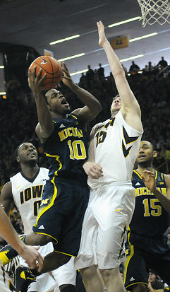 Derrick Walton Jr. (10) and Jon Horford (15)