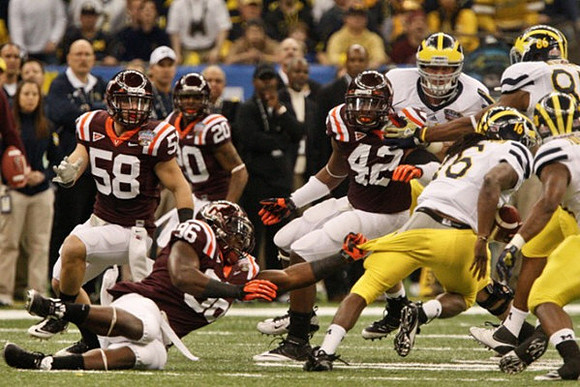 Denard Robinson (16) and Kevin Koger (86)