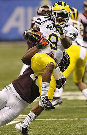 Martavious Odoms (9) and Brandon Herron (58)