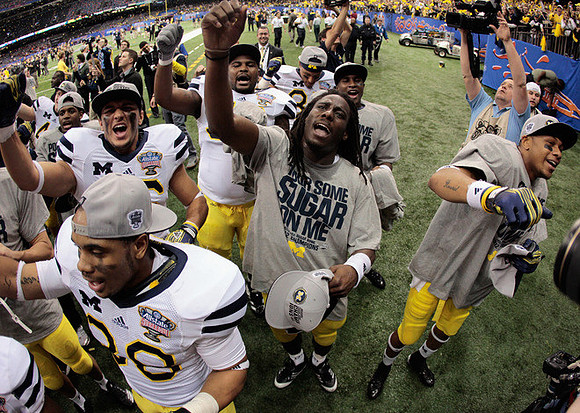 Denard Robinson (16) and Roy Roundtree (12)