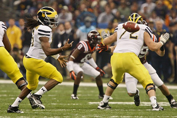 Denard Robinson (16) and Mark Huyge (72)