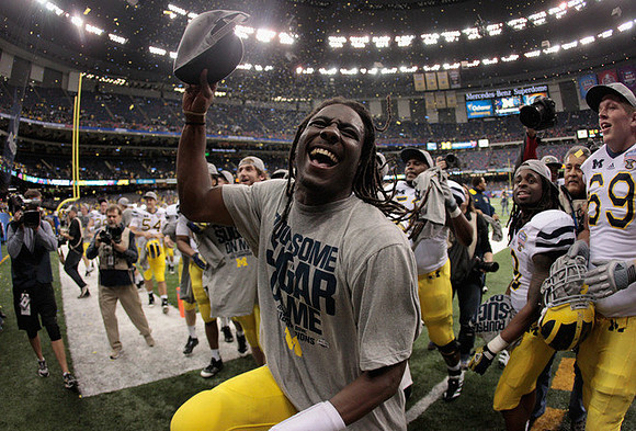Denard Robinson (16), Martavious Odoms (9), and Erik Gunderson (69)