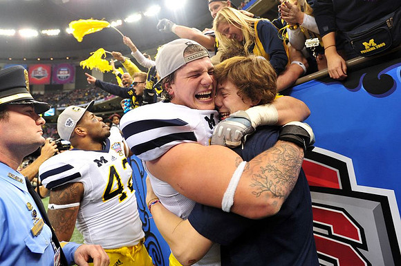 J.B. Fitzgerald (42) and Taylor Lewan (77)
