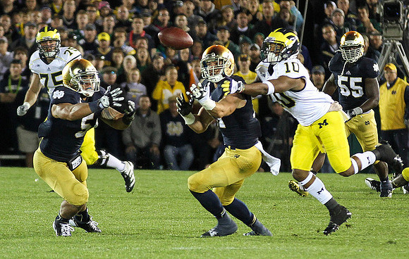 Michael Schofield (75) and Jeremy Gallon (10)