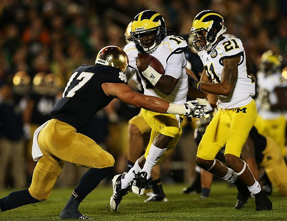 Denard Robinson (16) and Roy Roundtree (21)