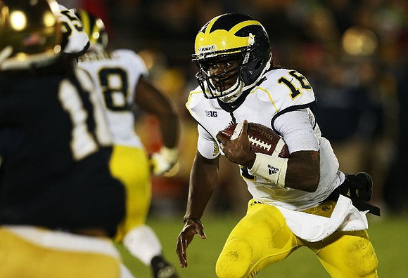 Patrick Omameh (65), Fitzgerald Toussaint (28), and Denard Robinson (16)
