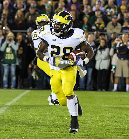 Denard Robinson (16) and Fitzgerald Toussaint (28)