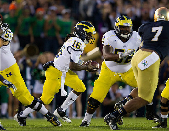 Elliott Mealer (57), Denard Robinson (16), and Ricky Barnum (52)