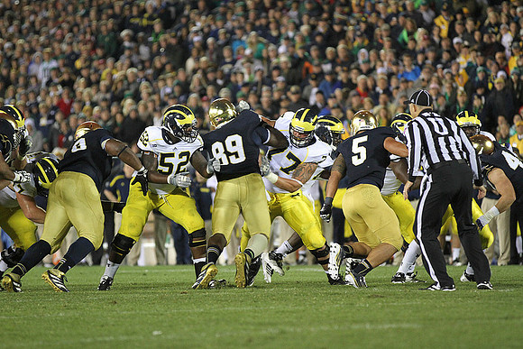 Ricky Barnum (52) and Taylor Lewan (77)