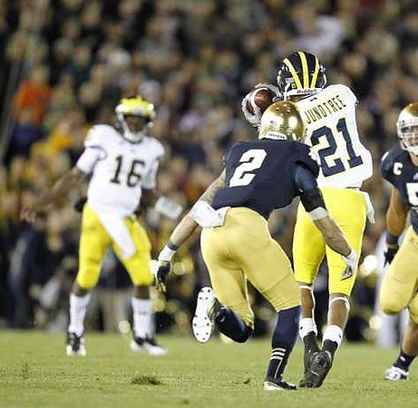 Denard Robinson (16) and Roy Roundtree (21)