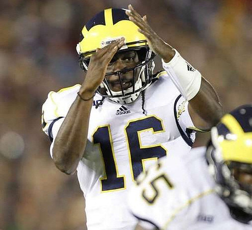Denard Robinson (16) and Patrick Omameh (65)