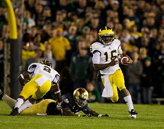Vincent Smith (2) and Denard Robinson (16)