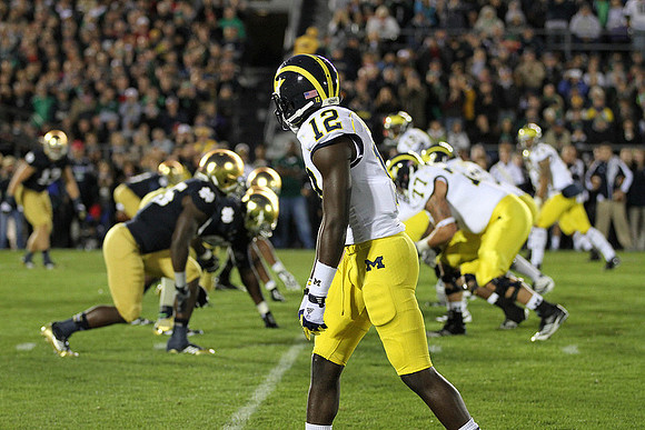 Devin Gardner (12) and Taylor Lewan (77)
