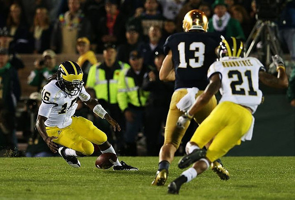 Denard Robinson (16) and Roy Roundtree (21)